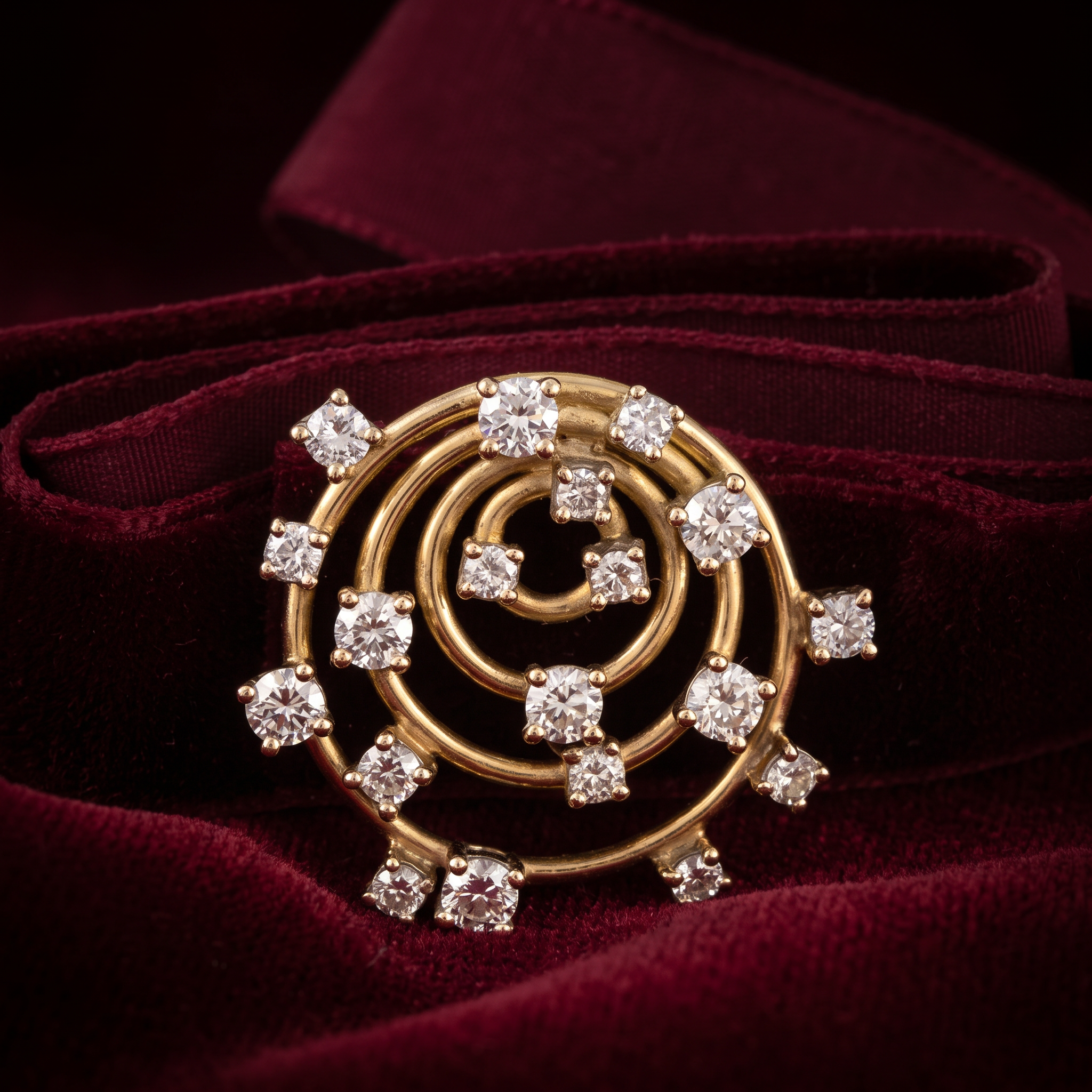 A gold spiral choker set with round brilliant diamonds, made at Glow Jewellers, on deep burgundy velvet